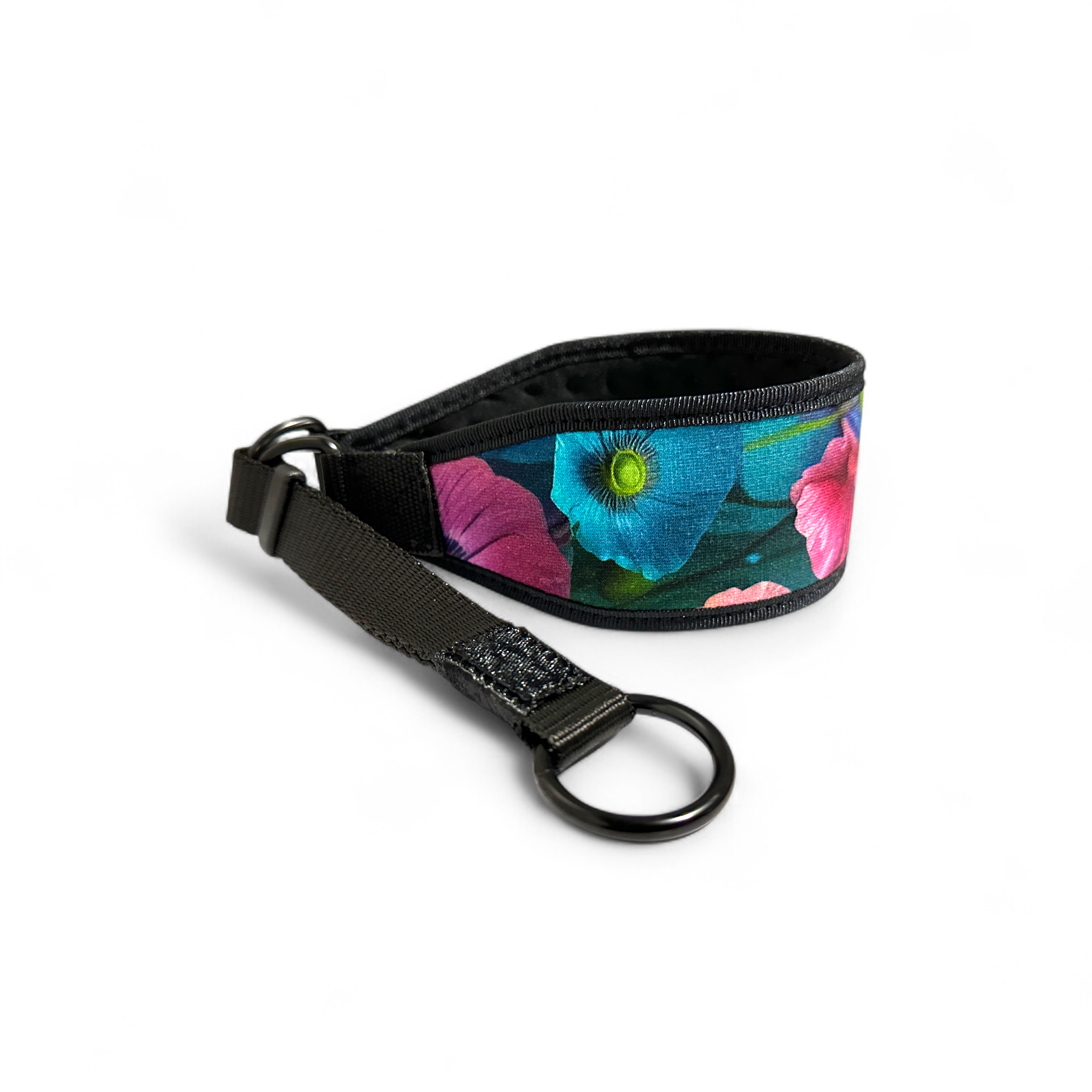 Floral-patterned dog collar with black strap on a white background