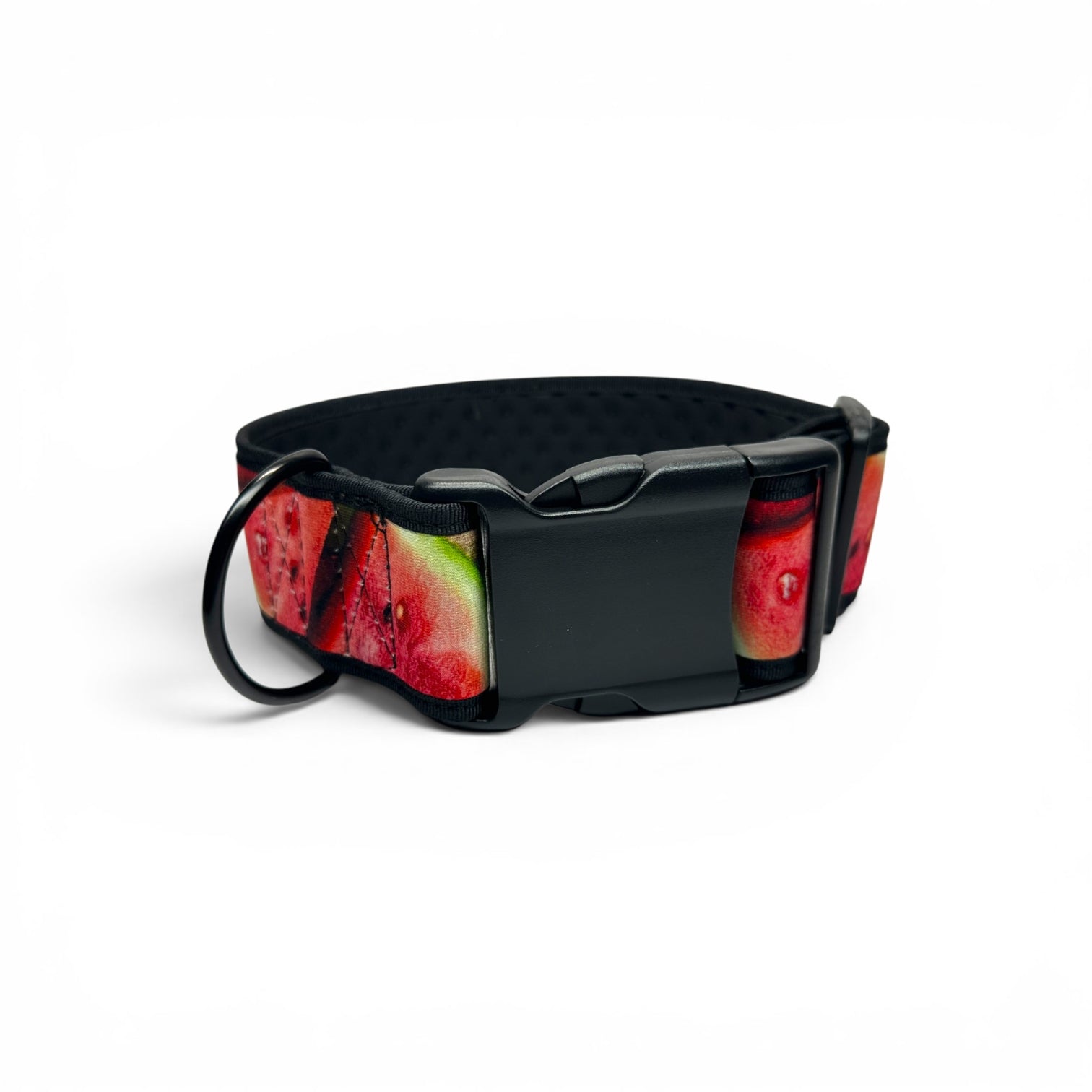 A black dog collar with a watermelon print pattern on the exterior and a black plastic quick-release buckle, shown on a white background.
