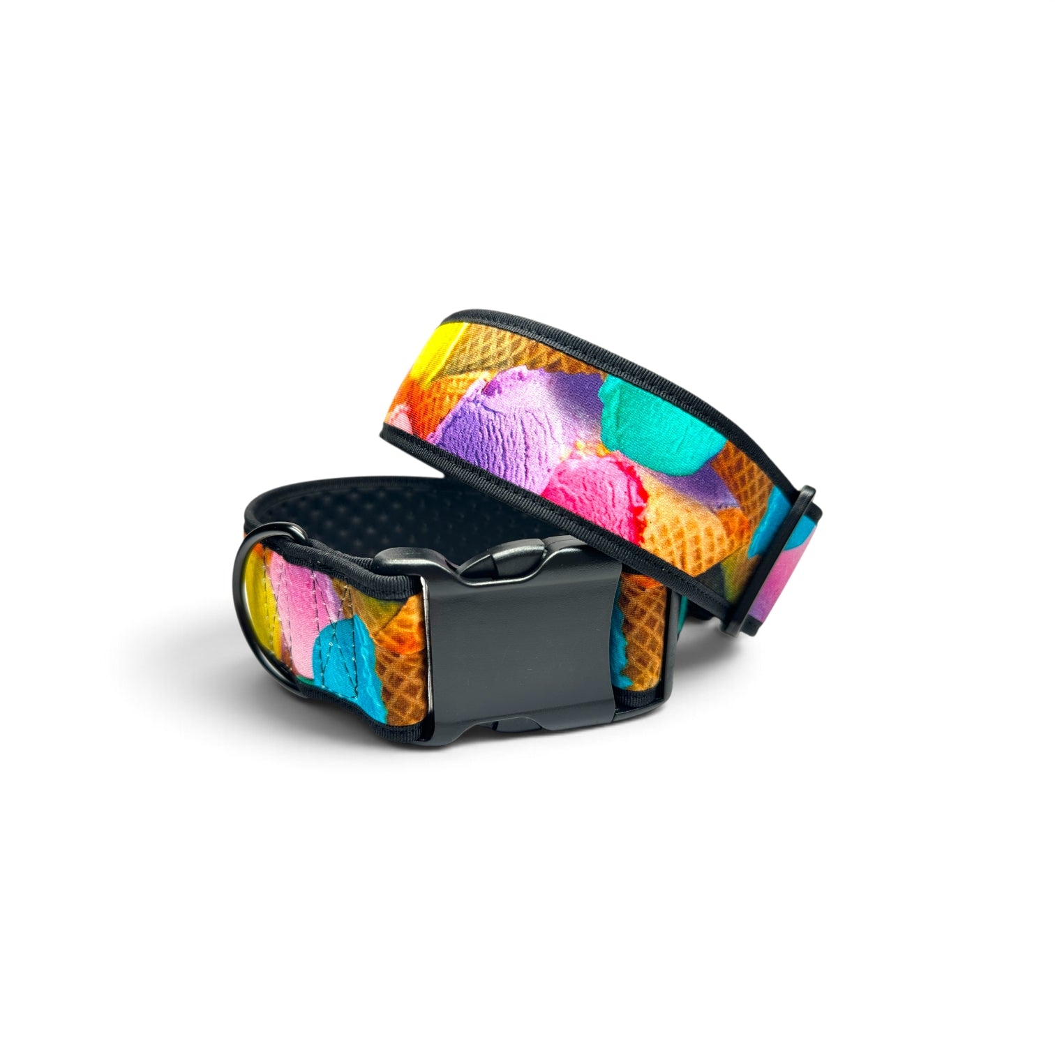 A dog collar with a colorful ice cream scoop pattern on a waffle cone background, featuring a black plastic buckle and black interior padding, shown on a white background.